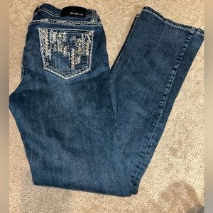 Grace. In LA size 30 blue jeans